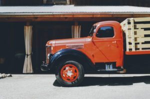 red truck carrying cargo for commercial transportation industry