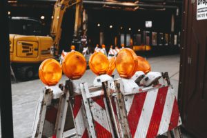 red and white striped safety signs and excavator for Pennsylvania Municipality Insurance