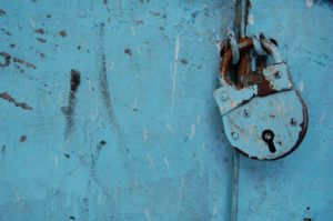 image of a blue metal lock for Gilbert's risk privacy and terms