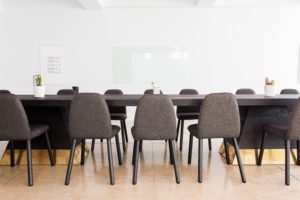 image of a conference room with grey chairs and a table for Pennsylvania risk management for customers