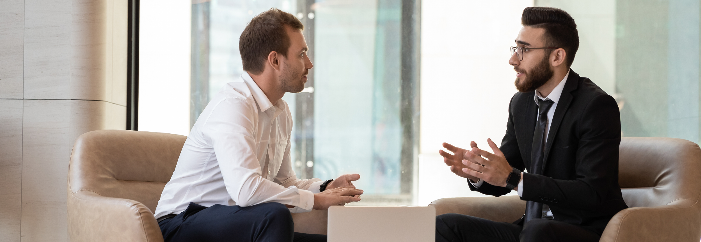 two businessmen discussing risk areas