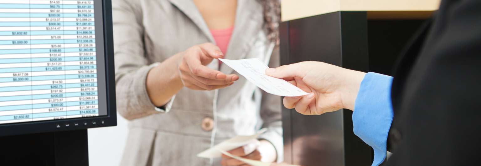 Bank teller interacting with a customer