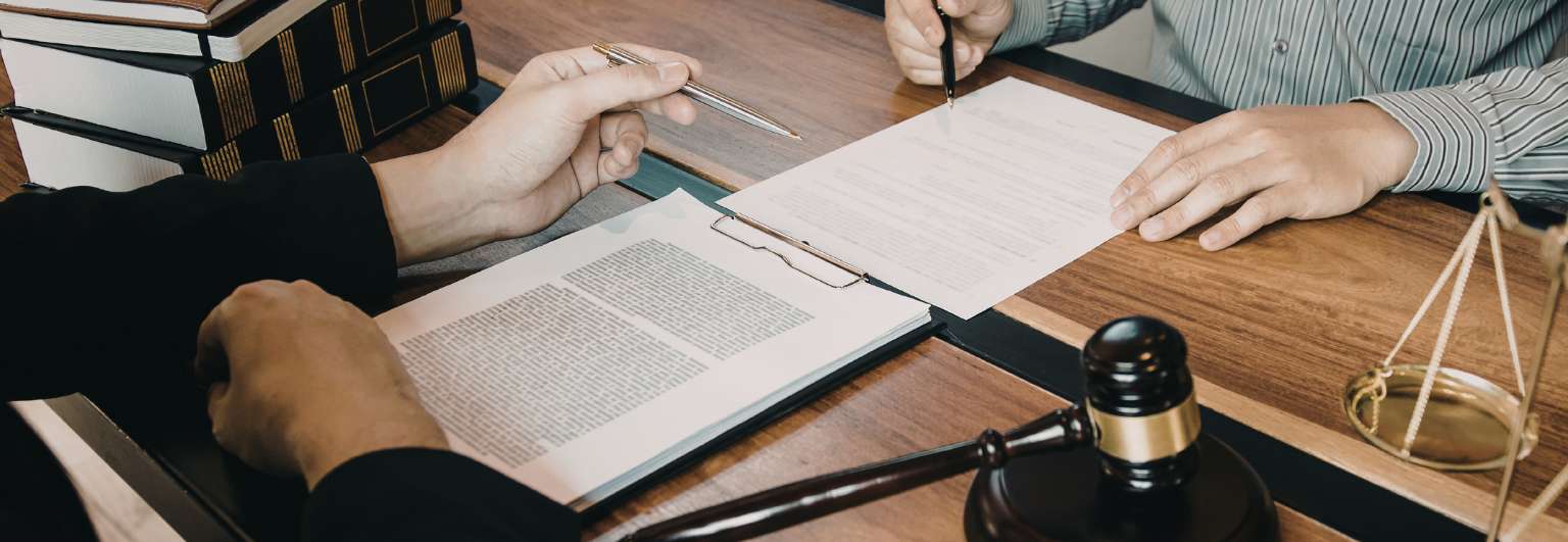 Professional lawyer and client meeting across a table